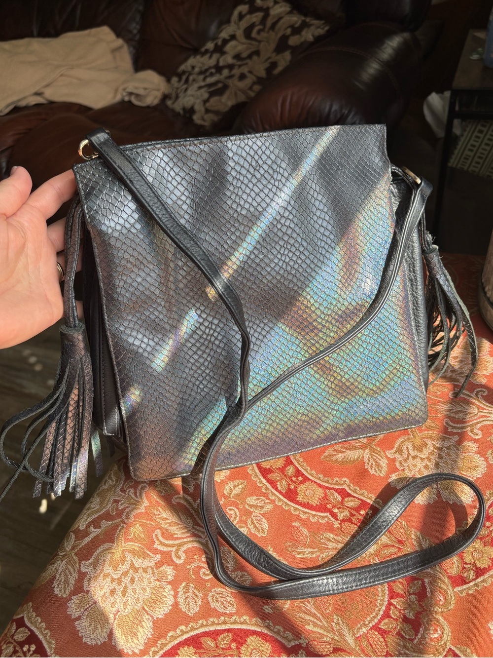 Kelly Wynne “oil spill” snake pattern purse